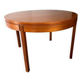 Extendable teak round table