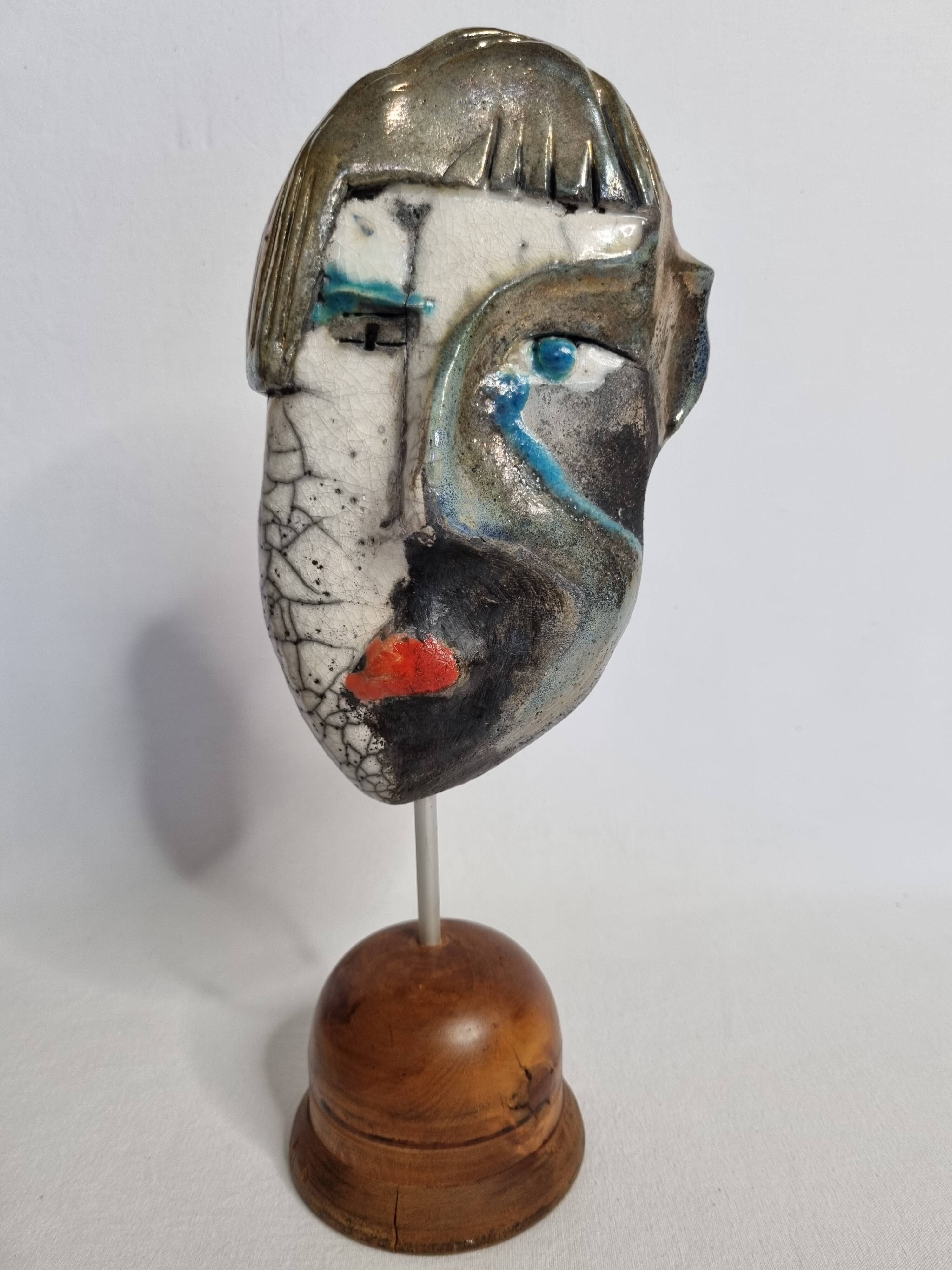Signed raku ceramic mask on wooden base Contemporary sculpture 30 cm