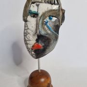 Signed raku ceramic mask on wooden base Contemporary sculpture 30 cm