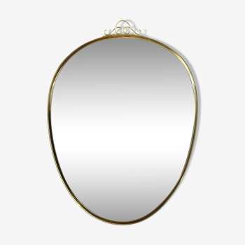 Free form mirror in brass frame