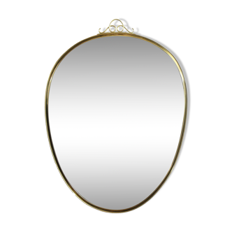 Free form mirror in brass frame