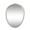 Free form mirror in brass frame