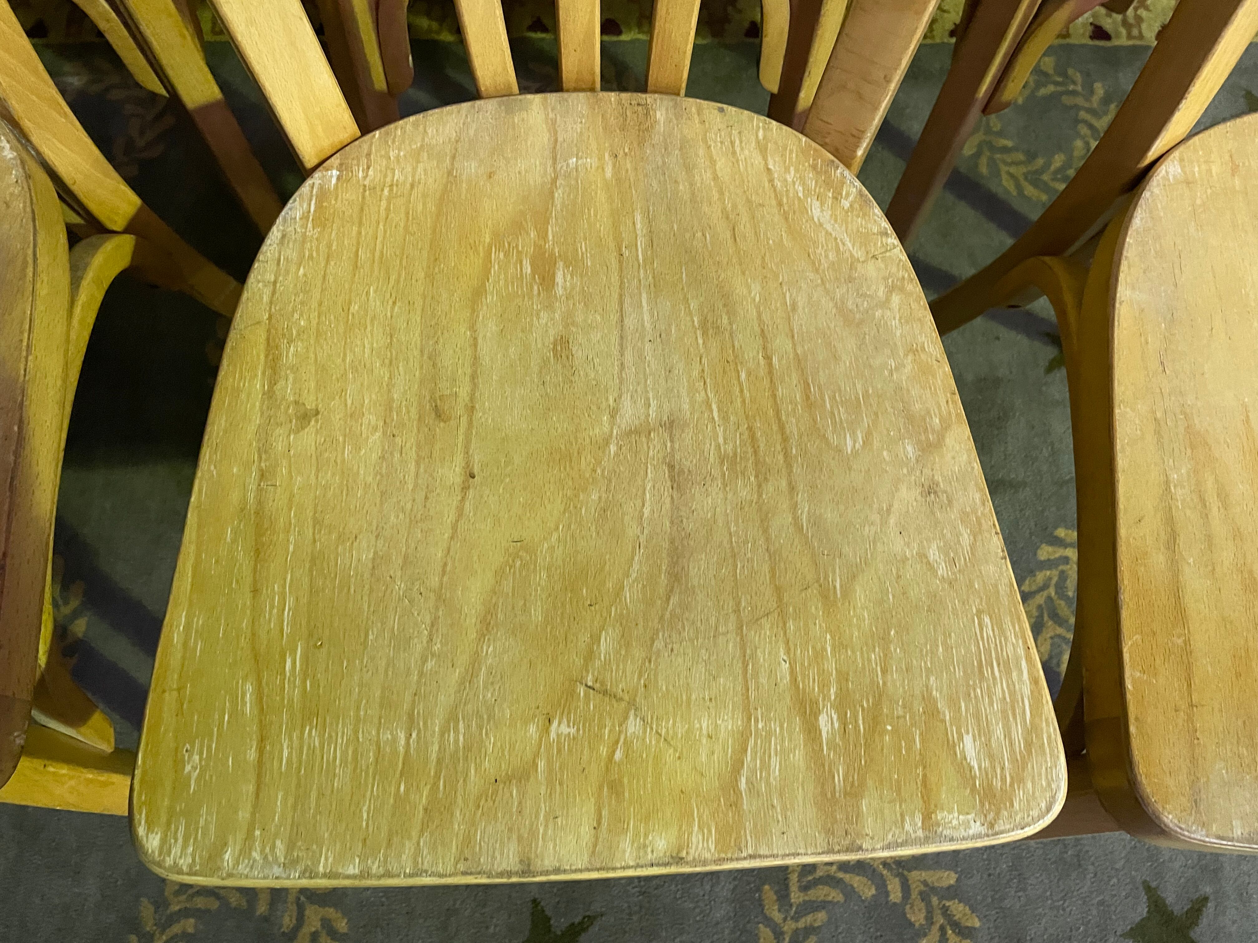 Suite of 6 bistro chairs signed "baumann"