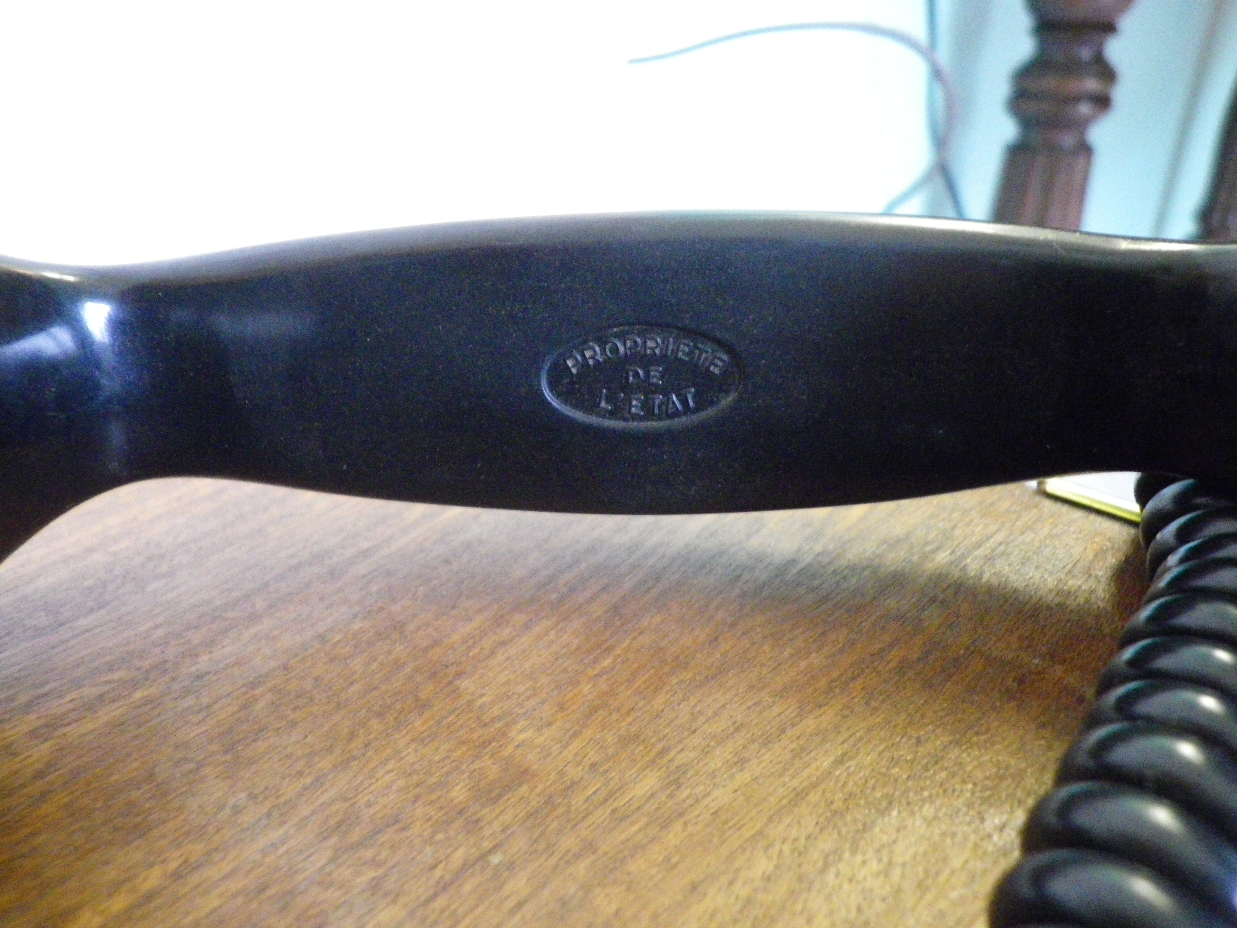 Black bakelite phone with earphone