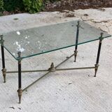 Regency style glass coffee table with crossed legs