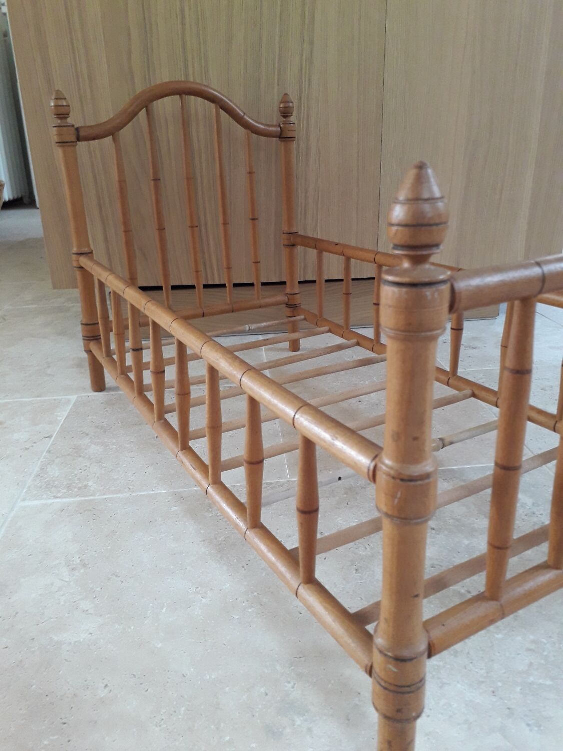 Old wooden doll's bed