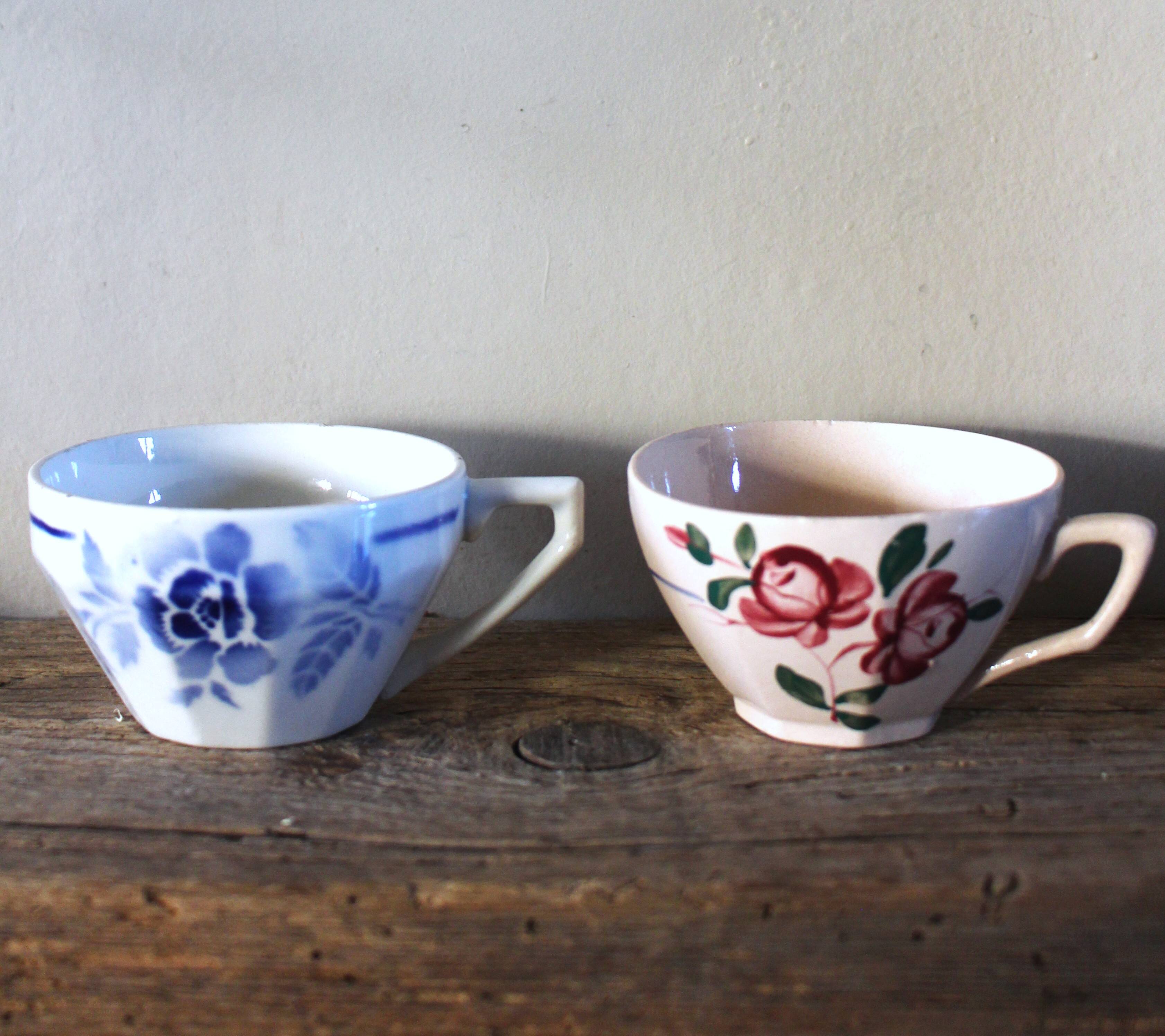A set of 2 Digoin Sarreguemines cups with pink and blue flowers.