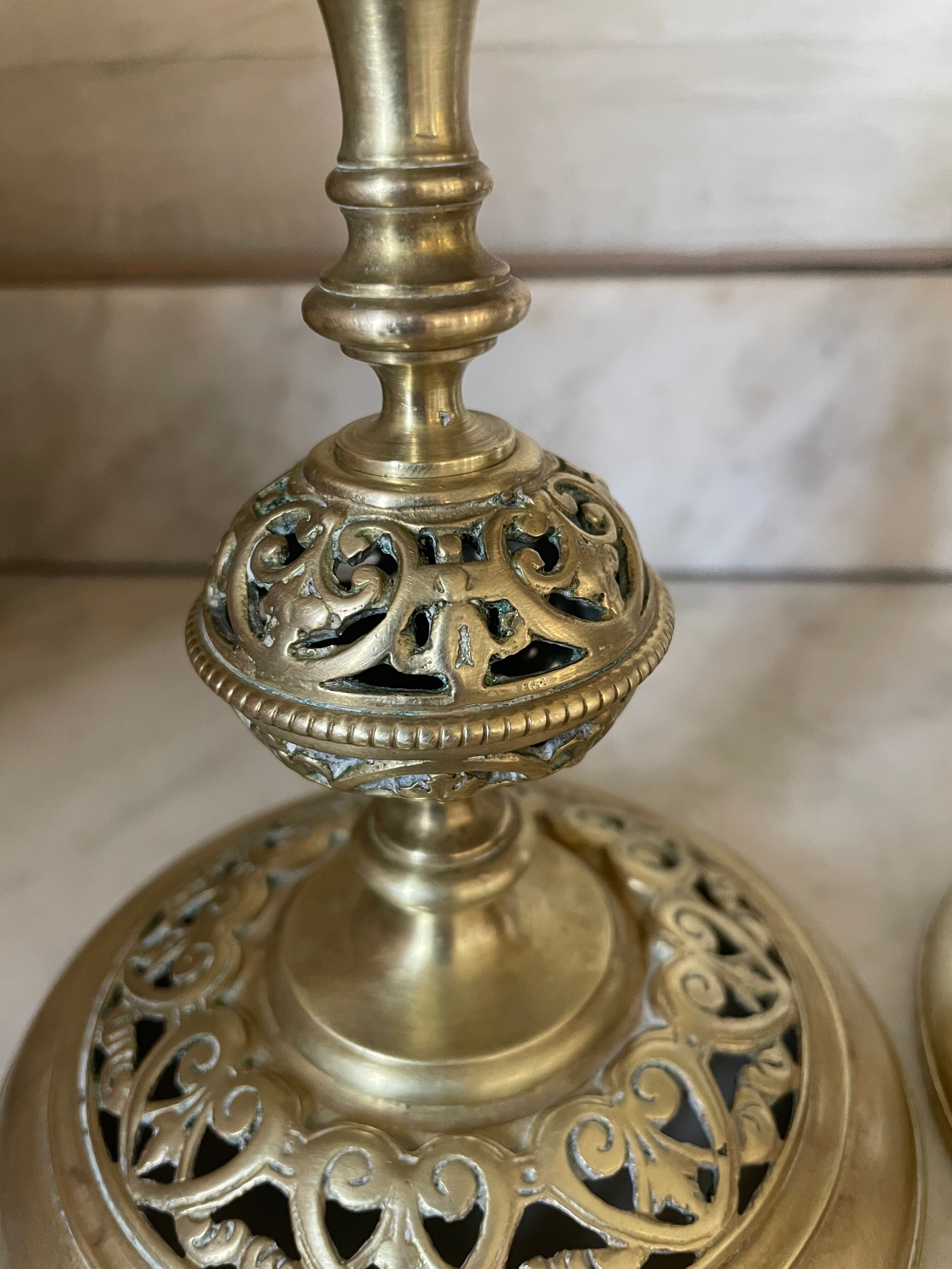 pair of openwork gilded brass candlesticks from the 19th century