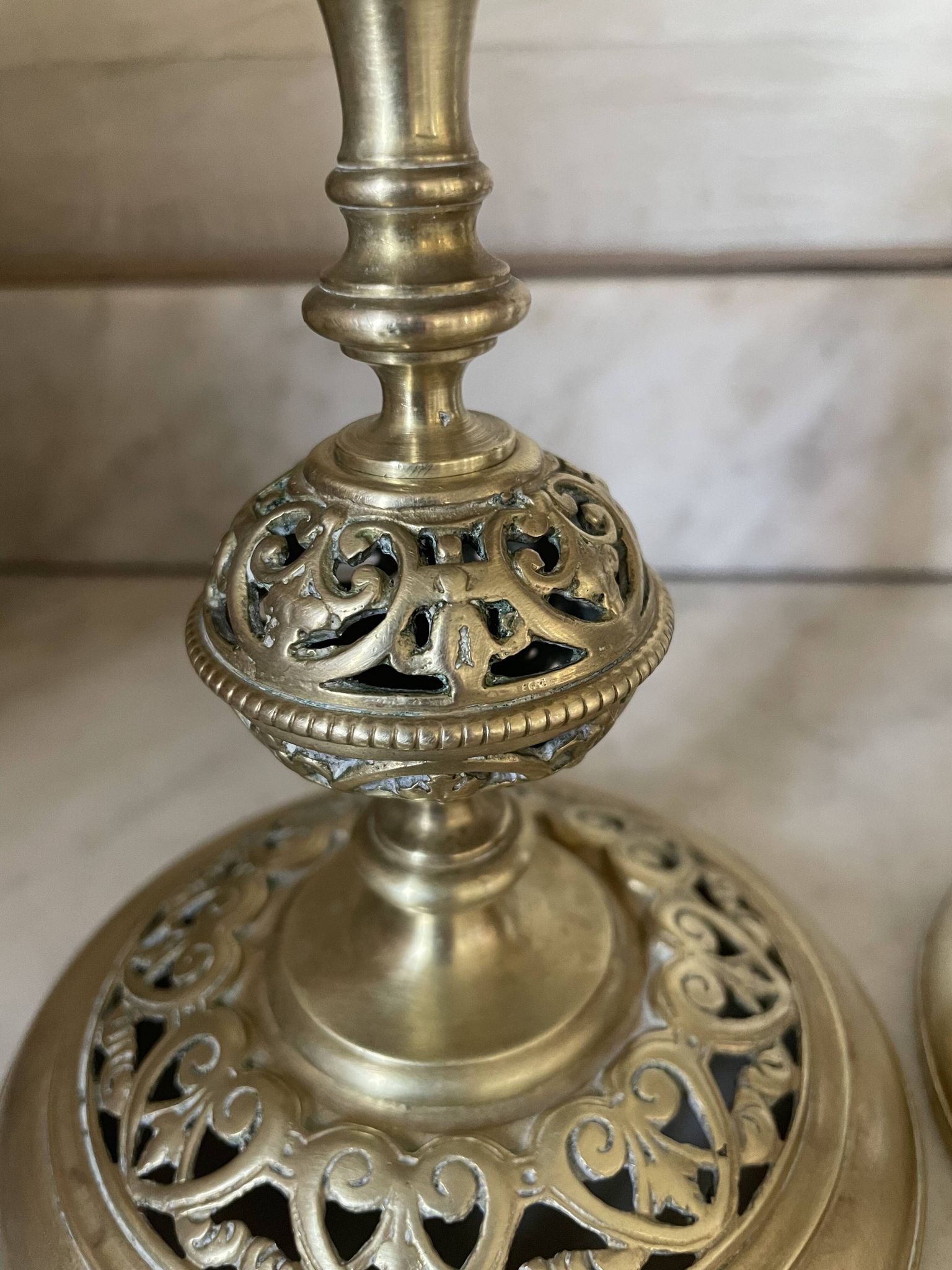 pair of openwork gilded brass candlesticks from the 19th century