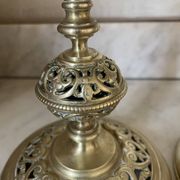 pair of openwork gilded brass candlesticks from the 19th century
