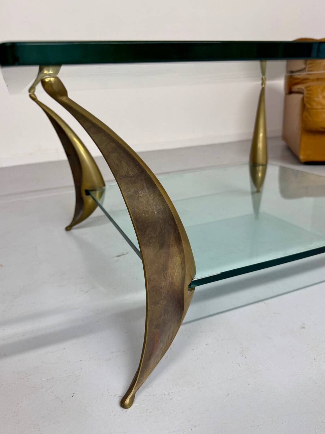 Glass coffee table with solid brass legs, Italian design from the 60s