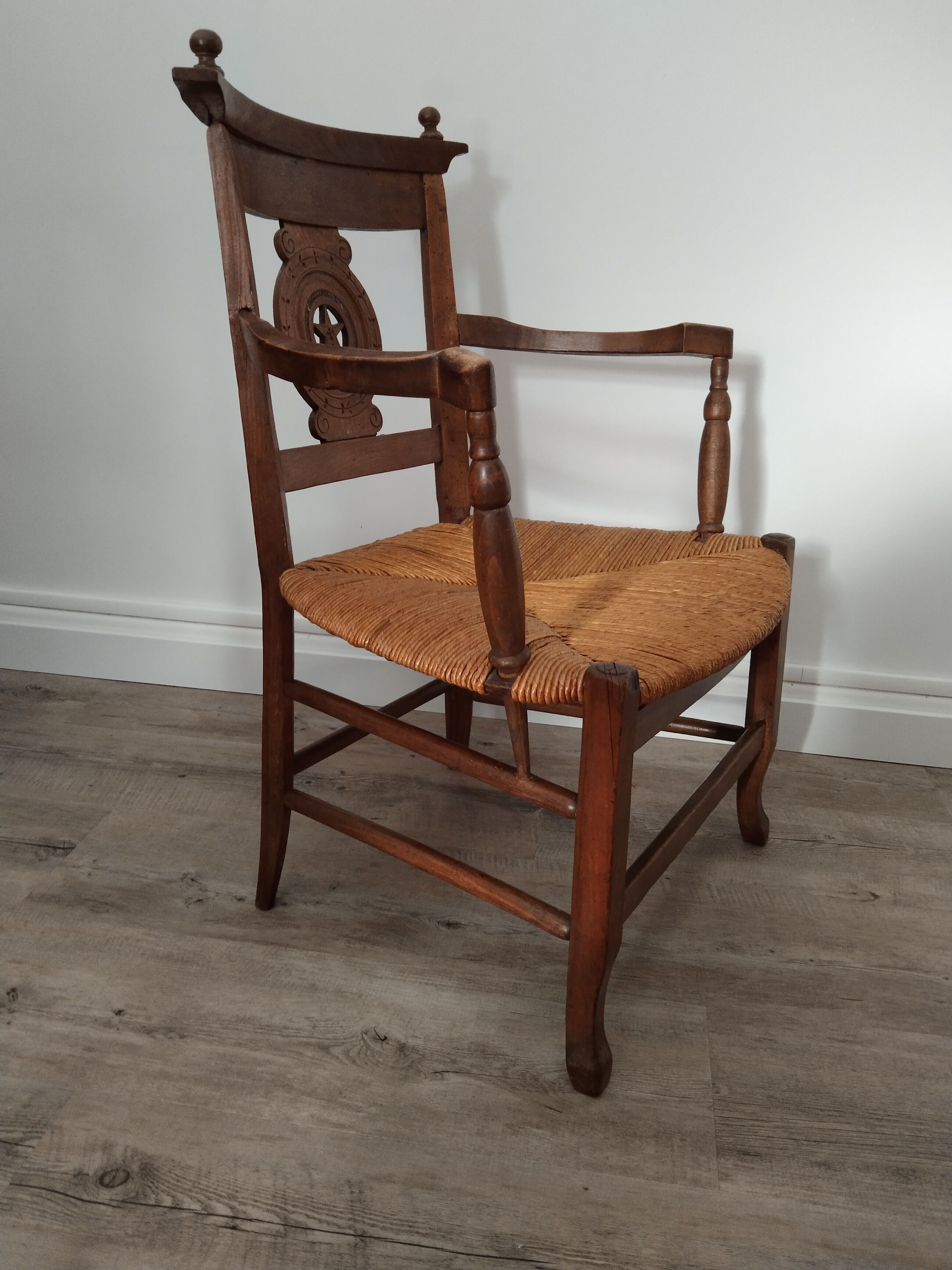 Straw armchair folk art.