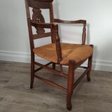 Straw armchair folk art.