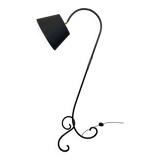 Design floor lamp in black lacquered metal and brass.