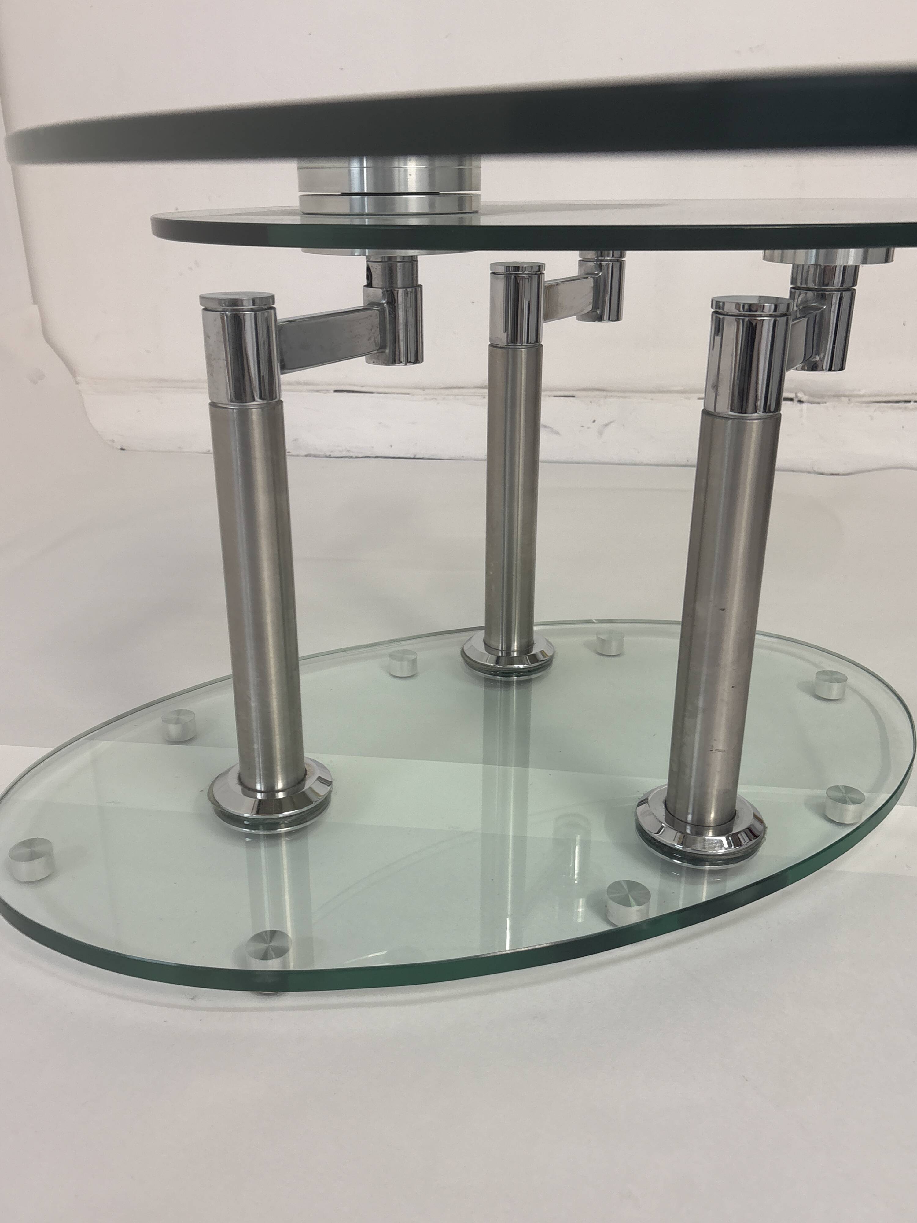 Oval designer coffee table in tempered glass