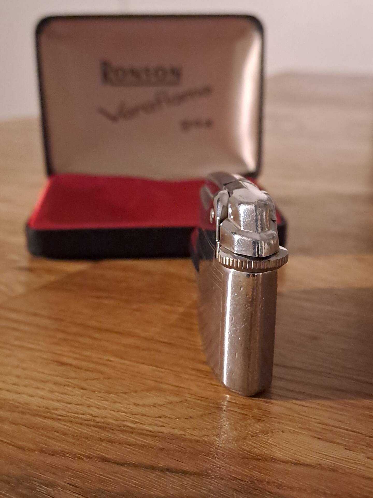 Vintage Ronson Varaflame chrome lighter and its original case.