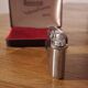 Vintage Ronson Varaflame chrome lighter and its original case.