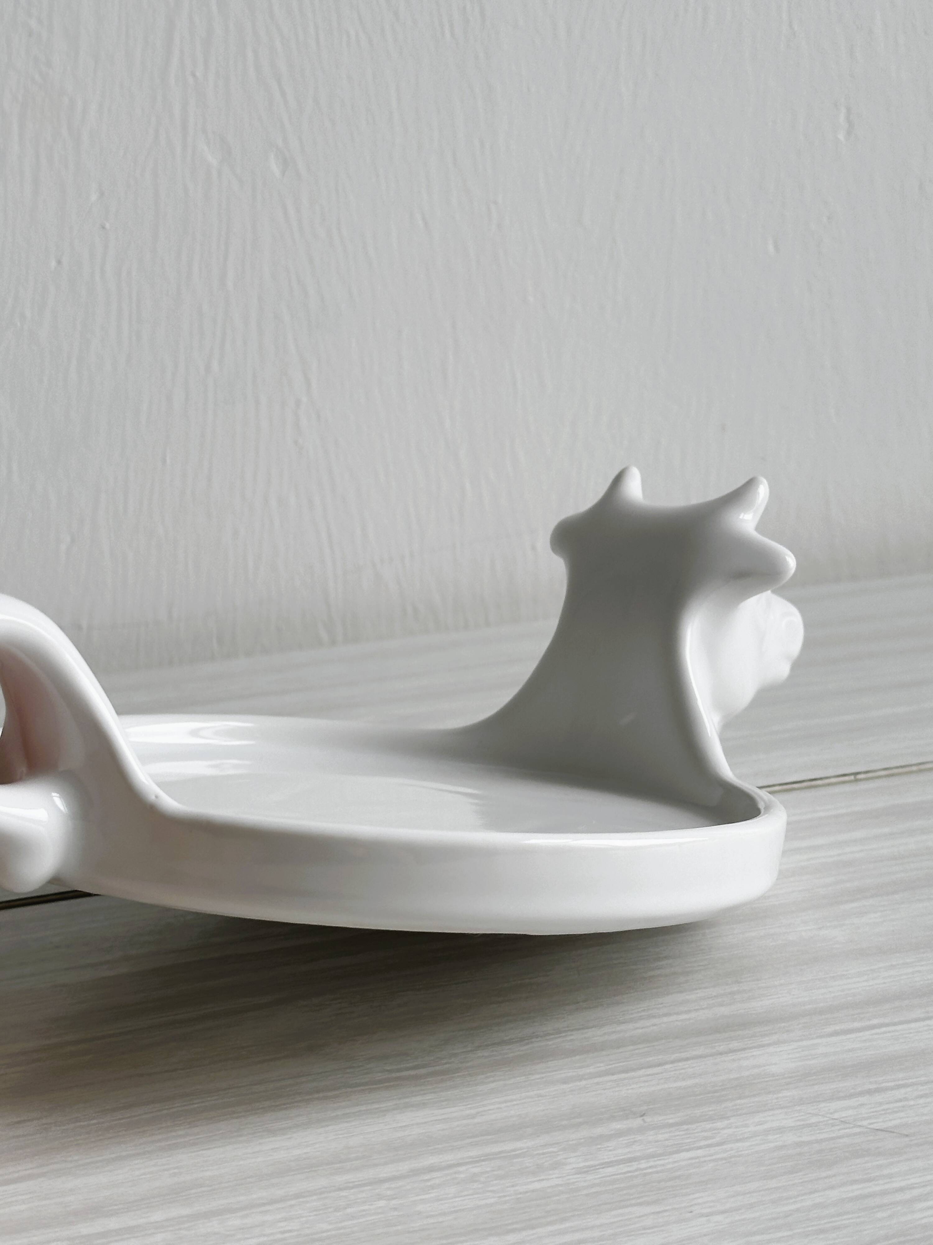 White porcelain cheese dish with handle and cow's head