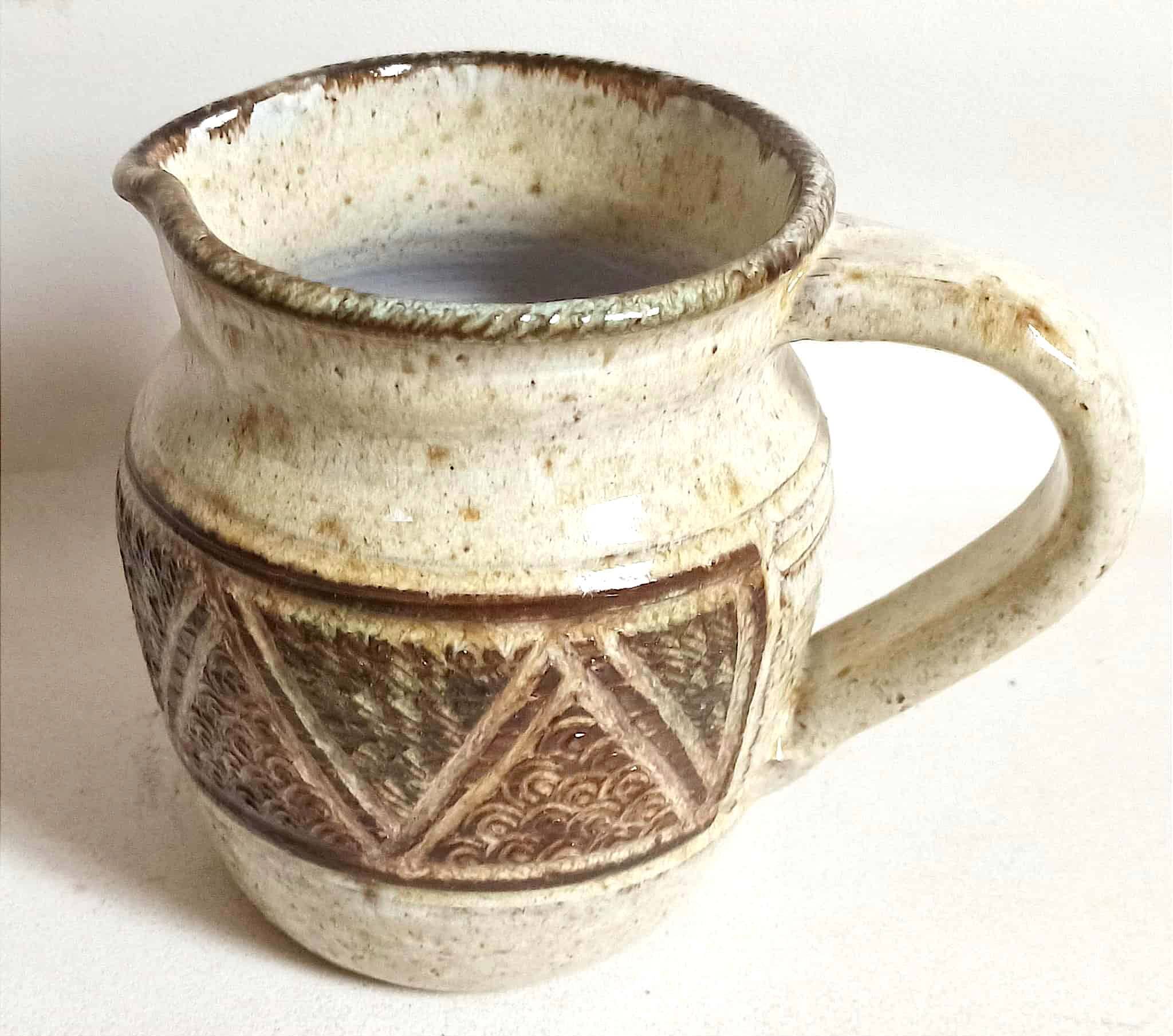 Stoneware pitcher stamped Giraud. Height 18.5 cm