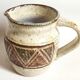 Stoneware pitcher stamped Giraud. Height 18.5 cm