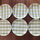 6 green and yellow checkered plates, tea towel