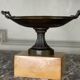 Bronze cup on a yellow Siena marble base, early 19th century.