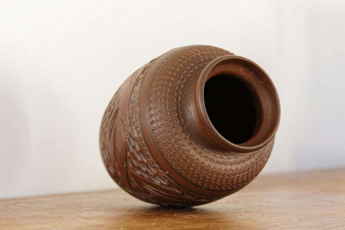 Carved terracotta vase, signed