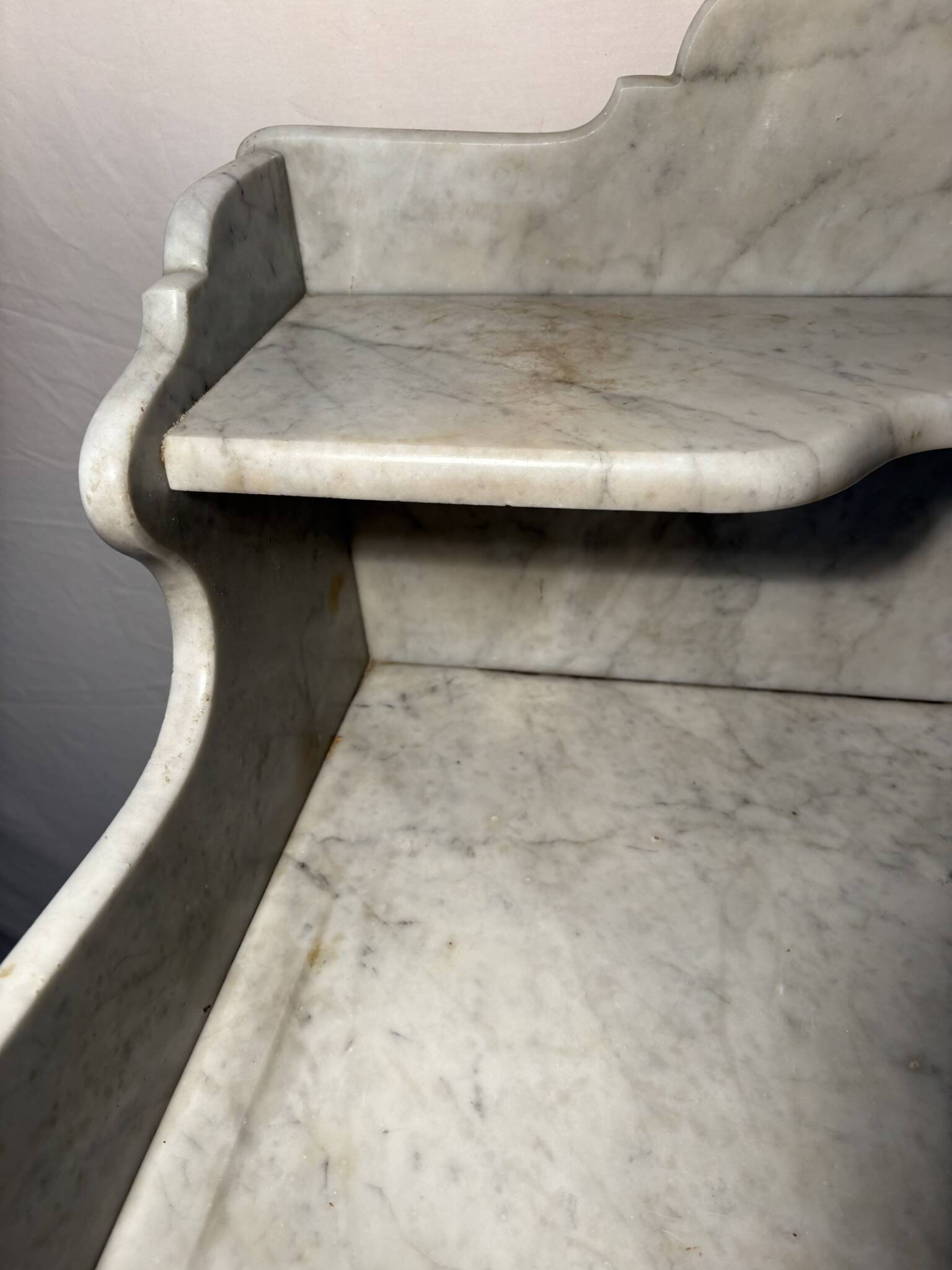 Antique wood and marble kitchen sideboard with carved backsplash