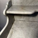 Antique wood and marble kitchen sideboard with carved backsplash