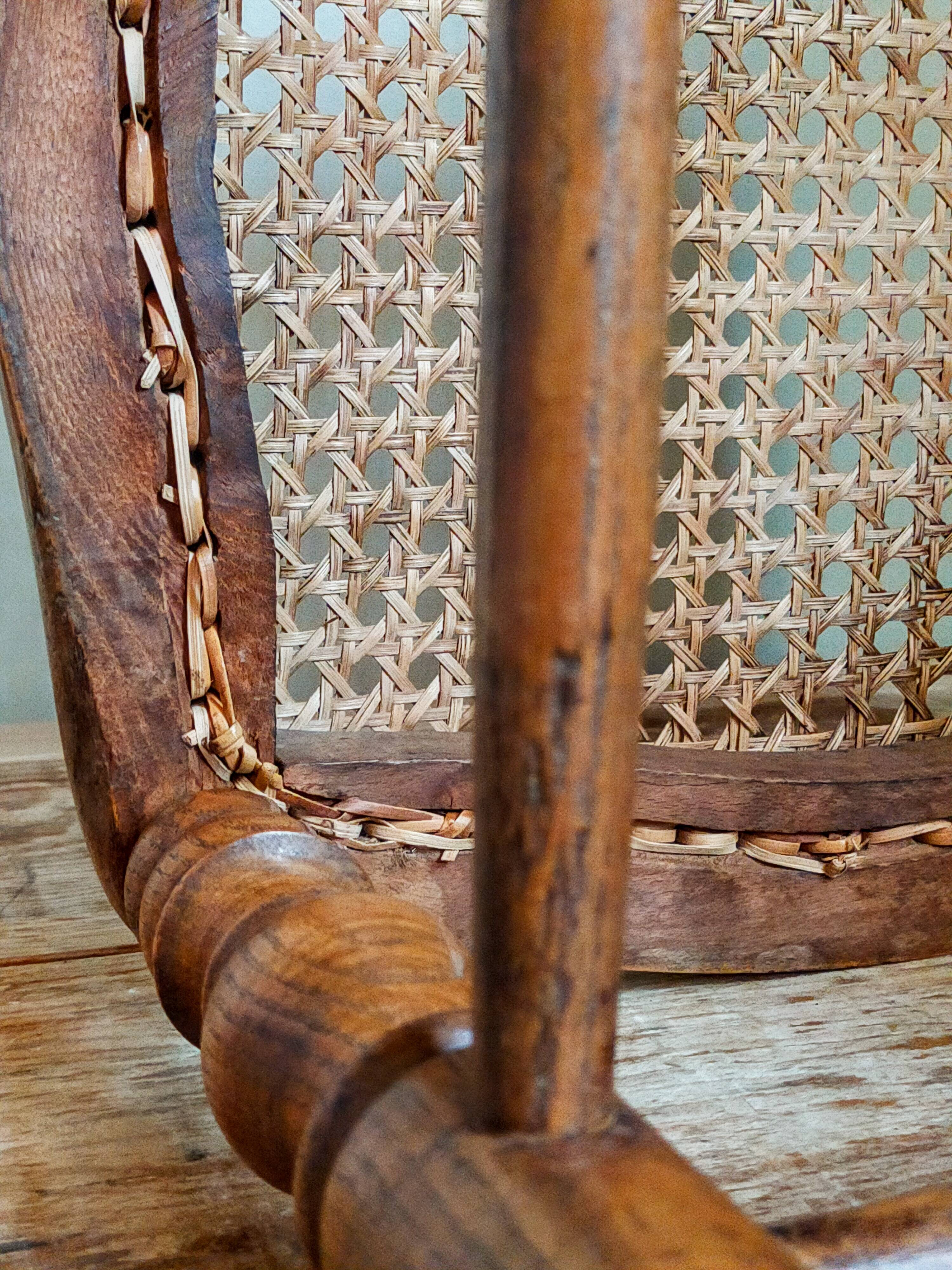 Antique stool with cane and turned wood