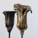 Pair of vintage brass candle holders with tulip decoration.