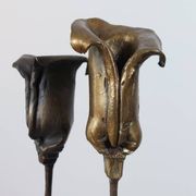 Pair of vintage brass candle holders with tulip decoration.