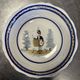 Large centrepiece table dish in earthenware with a painted decoration of a drummer.