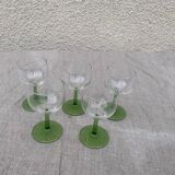 5 transparent glass glasses and green glass vase go
