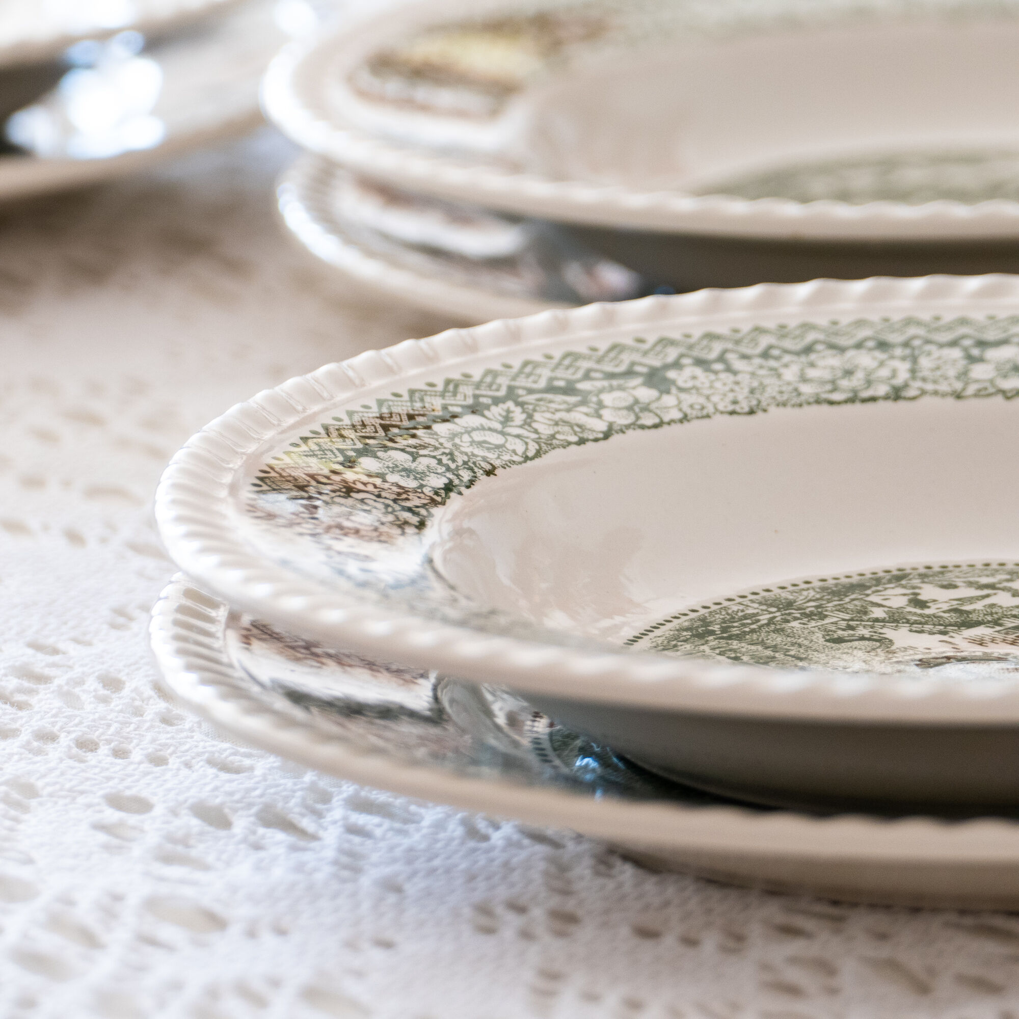Service of vintage green plates in country English earthenware