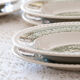 Service of vintage green plates in country English earthenware