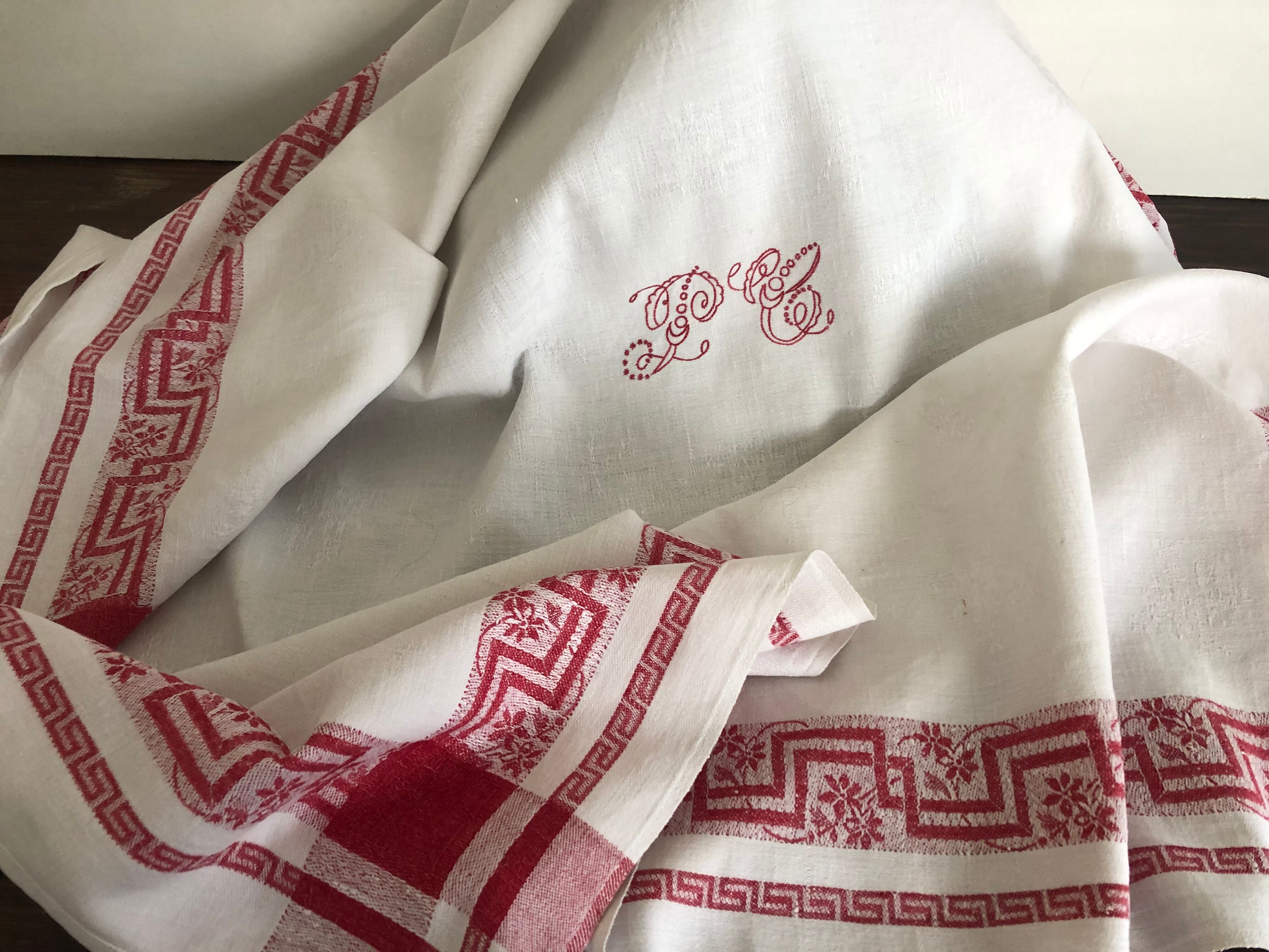 Ancient damask tablecloth with monogram