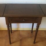 Table has two acajou tinted flaps