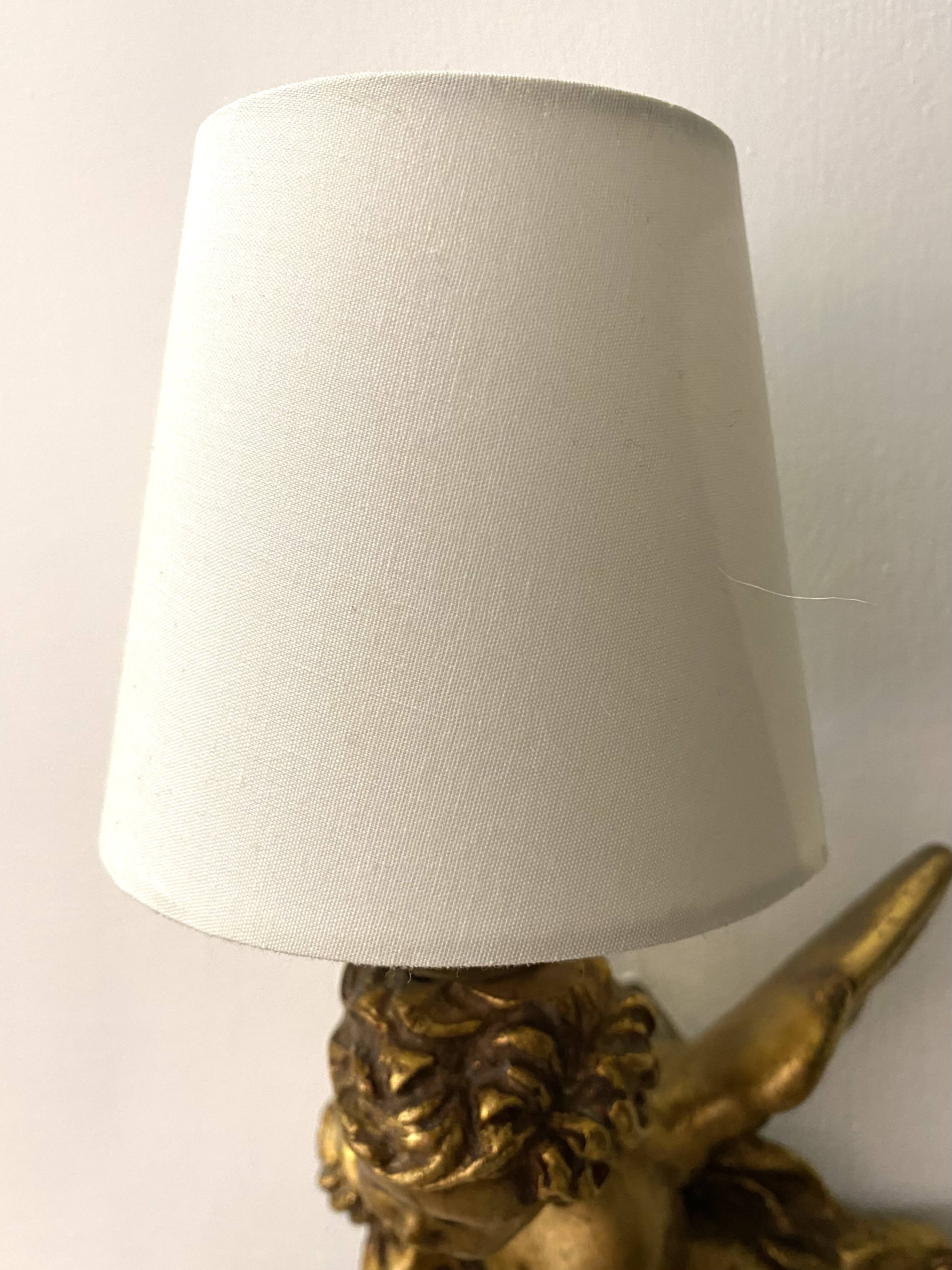 Pair of golden Puttis wall lights