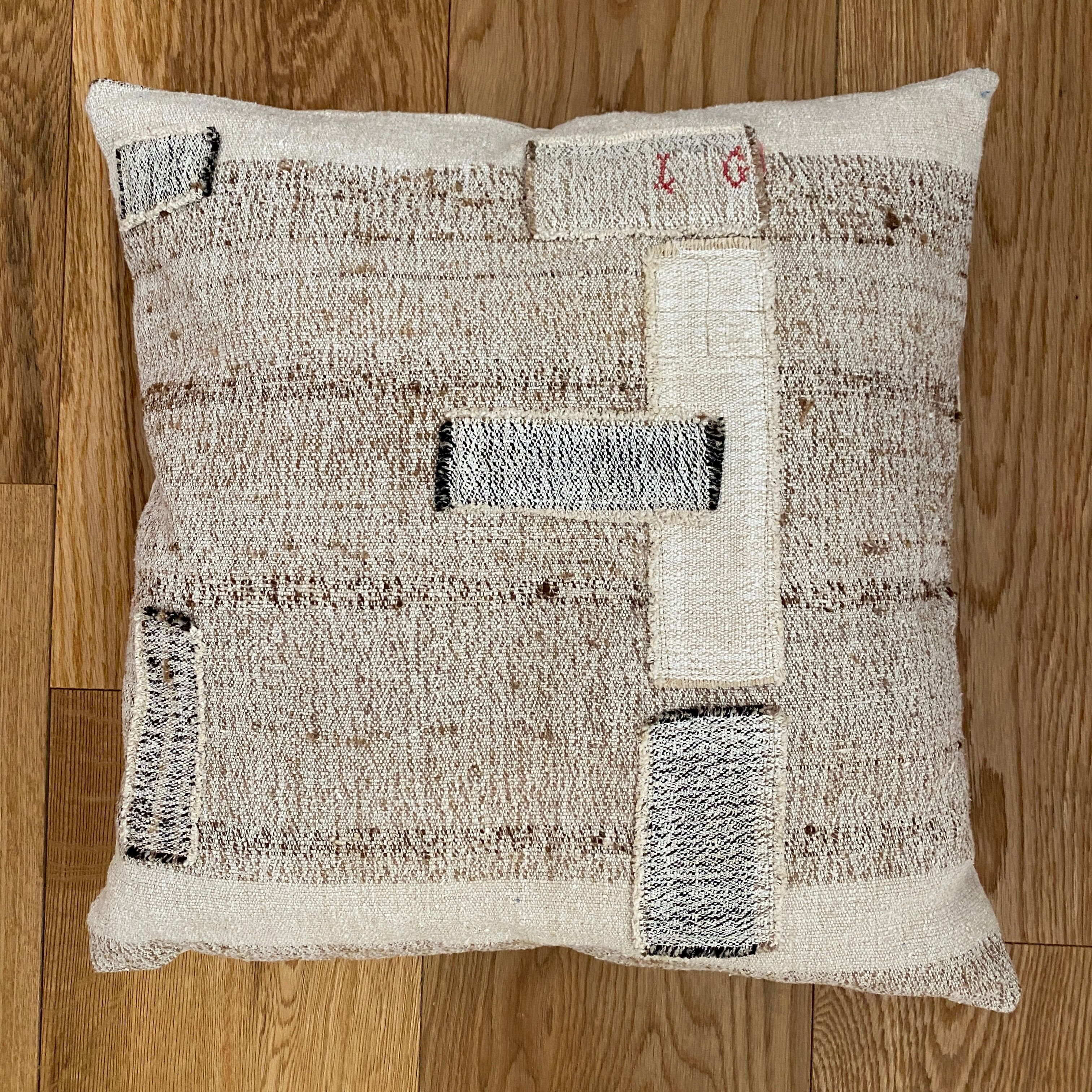 Old canvas cushion woven kilim style, patched