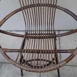 Shell-shaped armchair in rattan with metal legs. Caravane brand.