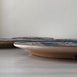 4 colorful flat plates with a fish pattern