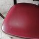 Set of 19 vintage wooden bistro chairs with red faux leather.