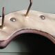 Wooden coat rack, nails & cowhide