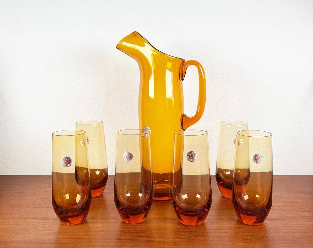 Amber glass carafe from the mid-century German Jagdhaus series and drinking glasses by Wilhelm Braun-Feldweg for Hirschberg, 1960s, set of 7.