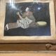 Framed painting of a man on mica.