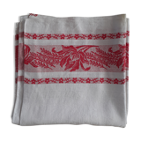 Nappe damasèe ancienne entourage frise rouge monogramme central rouge.