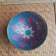 Brass footed bowl with coloured patterns