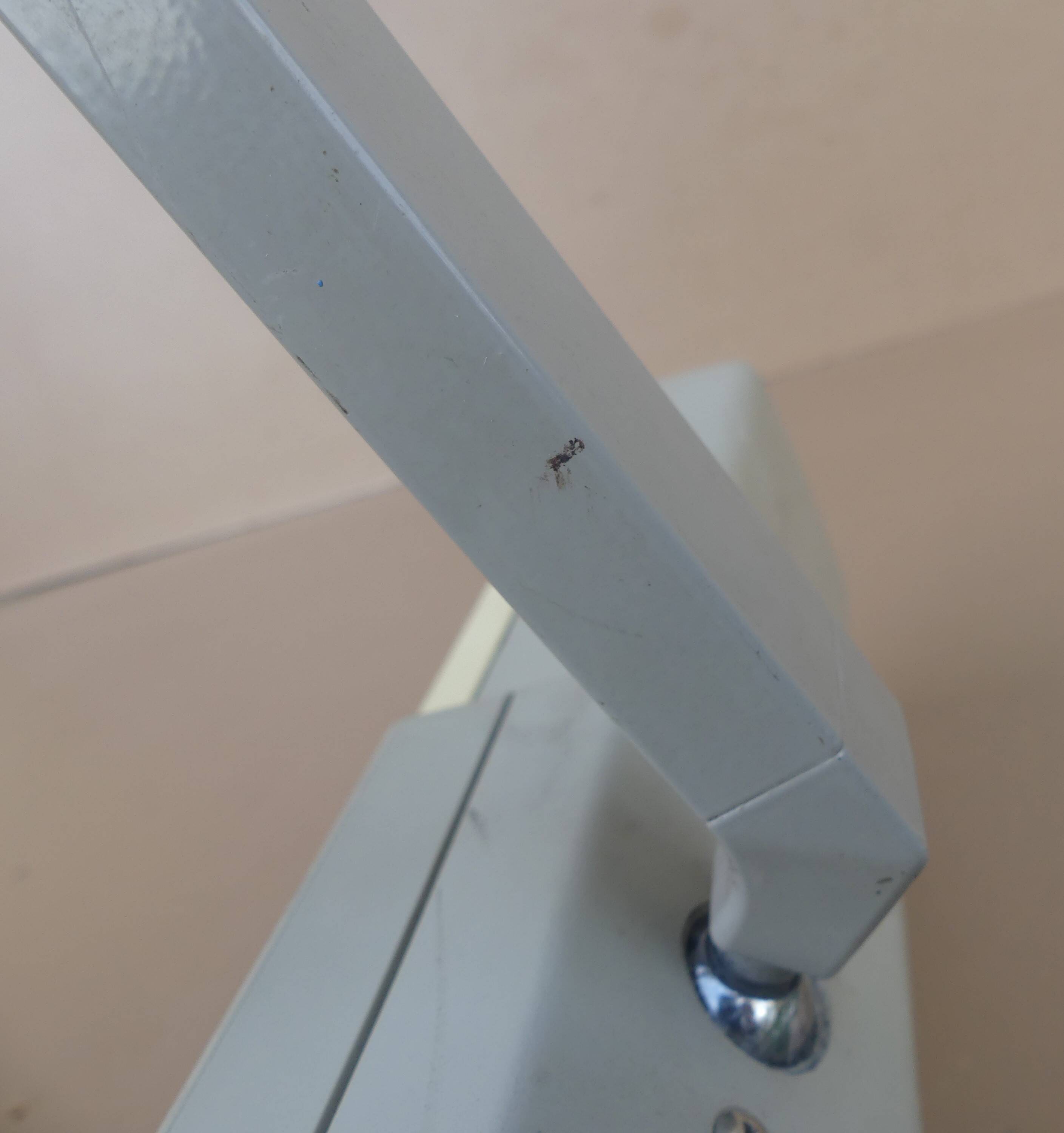 WALDMANN articulated workshop lamp with two industrial clamp arms for architects.