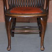 Antique English Edwardian captain's chair in oak by Ralph Johnson.